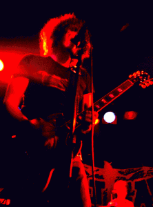 Mat Bethancourt getting his red on, performing at Roadburn 2005 with Josiah. (photo by Jo Jo)